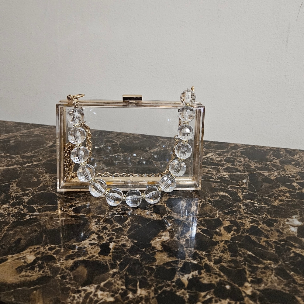 Clear Acrylic Gold Trimmed Breaded Chain Clutch